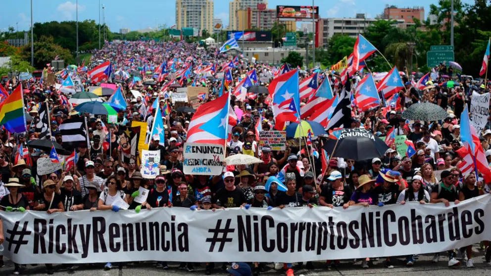 Thousands of Puerto Ricans gather for what many are expecting to be one of the biggest protests ever seen in the U.S. territory, with irate islanders pledging to drive Gov. Ricardo Rossello from office, in San Juan, Puerto Rico, Monday, July 22, 2019. Protesters are demanding Rossello step down for his involvement in a private chat in which he used profanities to describe an ex-New York City councilwoman and a federal control board overseeing the island's finance. (AP Photo/Carlos Giusti)